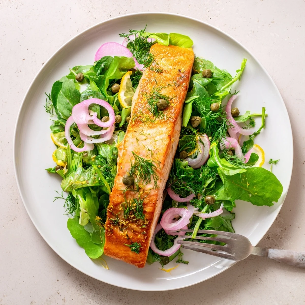 Pan-seared Tasmanian Atlantic salmon with irresistibly crispy golden skin paired with zesty caper salad