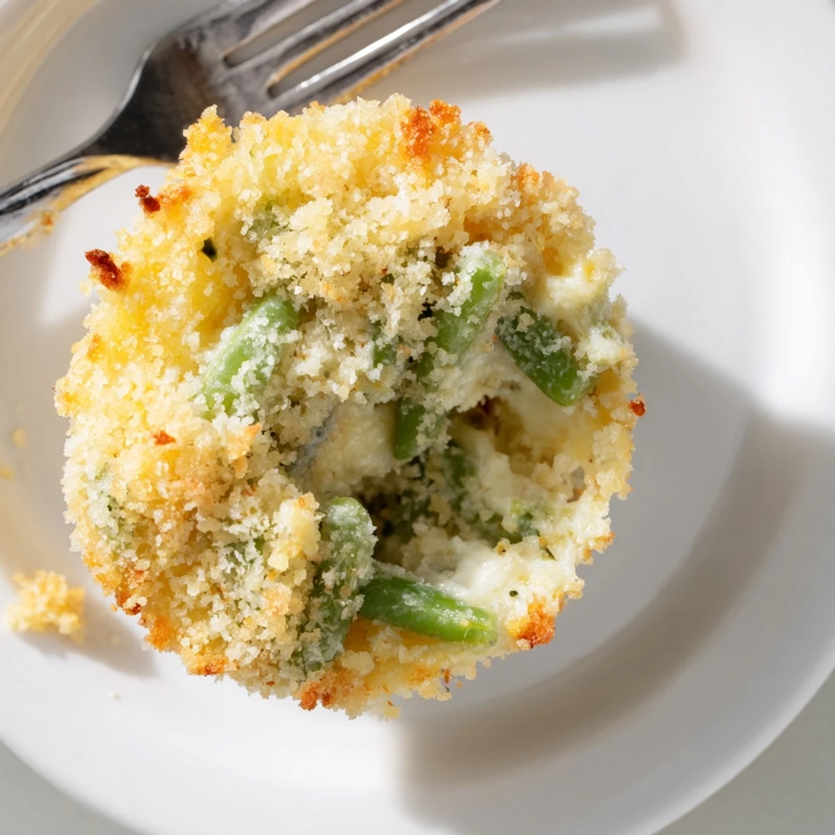 Fresh green beans baked in savory garlic Parmesan mixture in muffin tin cups