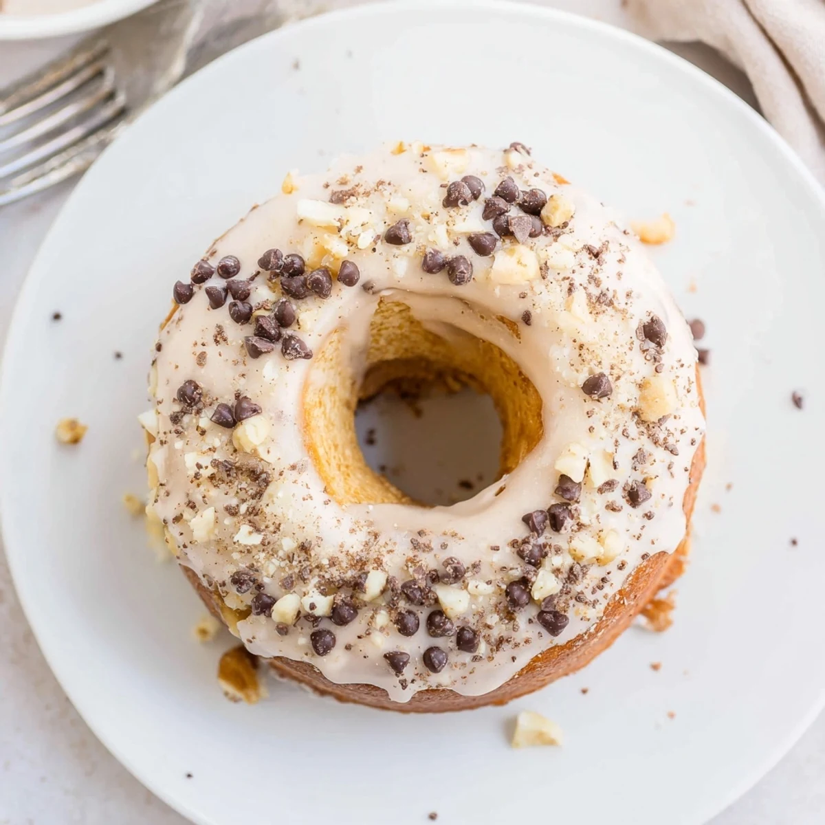 Warm Banana Donuts glazed and stacked on a wire rack, golden aroma