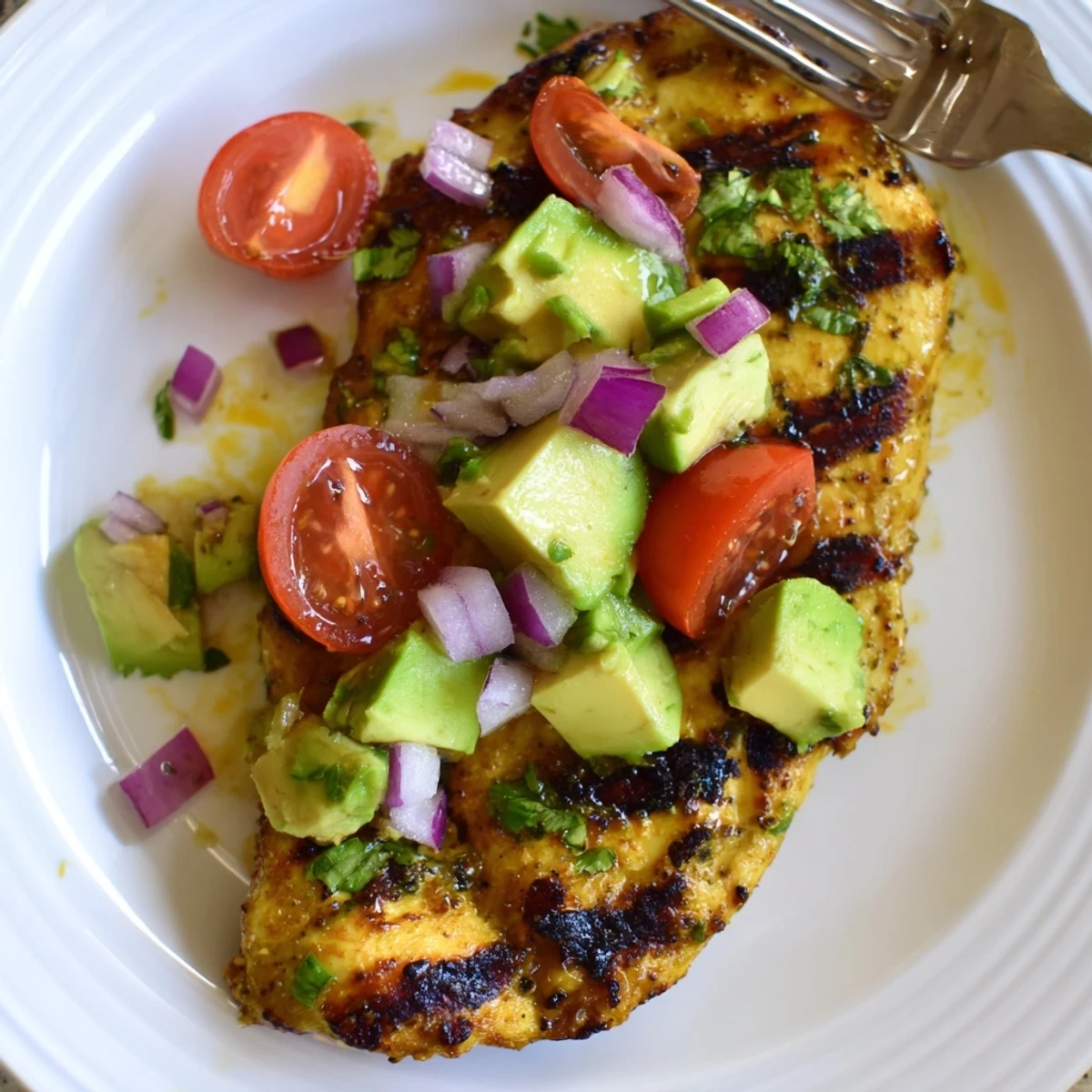 Sliced Fiesta Lime Chicken With Avocado served over rice, juicy, zesty bites