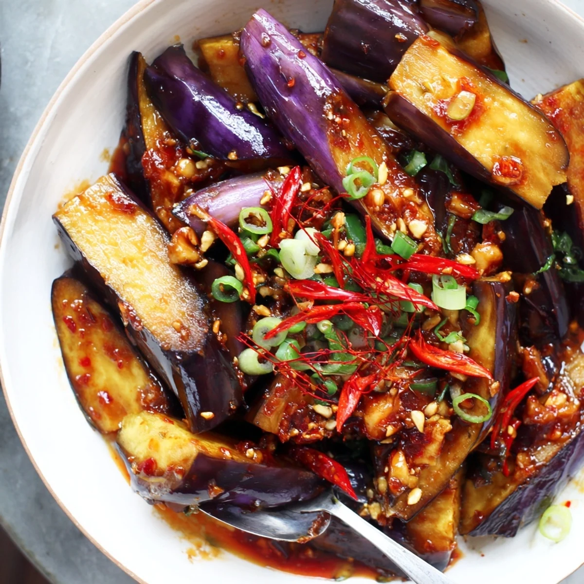 Pan-seared Sichuan Style Braised Aubergines coated in glossy chili doubanjiang sauce