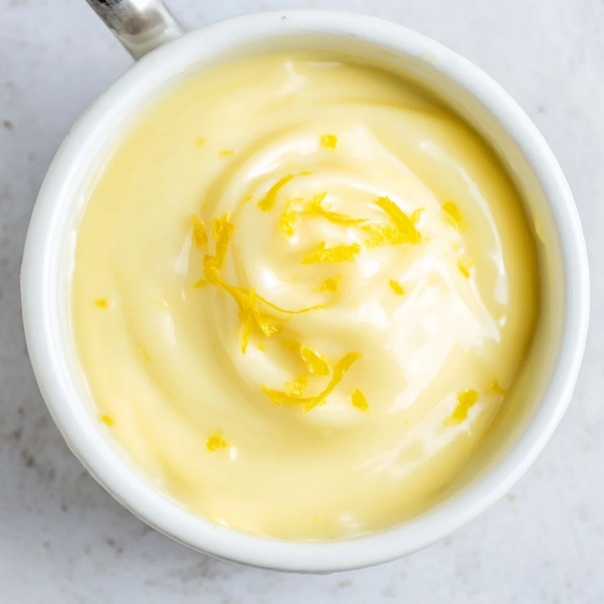 Zesty Lemon Curd Recipe spooned over yogurt bowl, creamy contrast and aroma