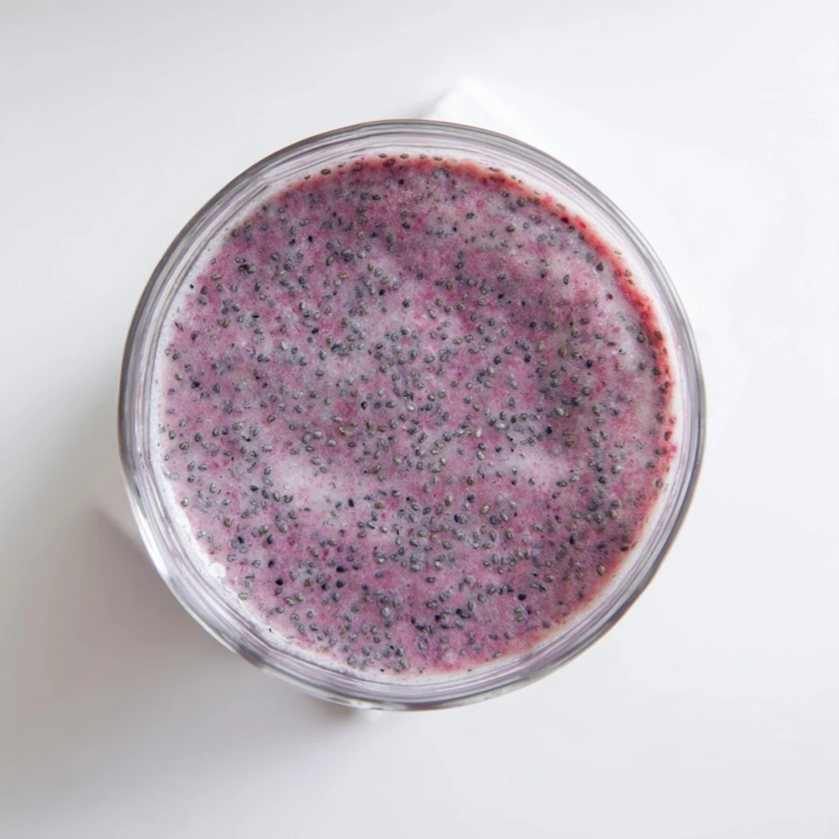 Creamy chia seed smoothie blended with banana and mixed berries for a refreshing breakfast