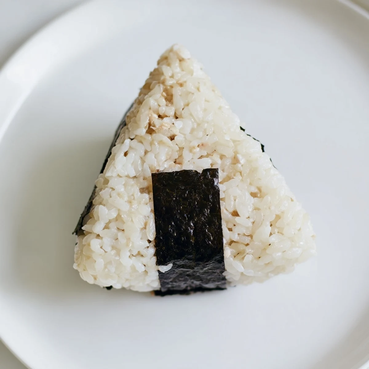 Golden brown tuna mayo onigiri rice balls wrapped in crisp nori seaweed strips